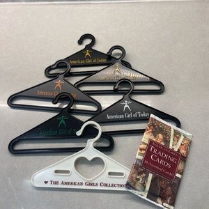 American girl hangers and one pack trading cards